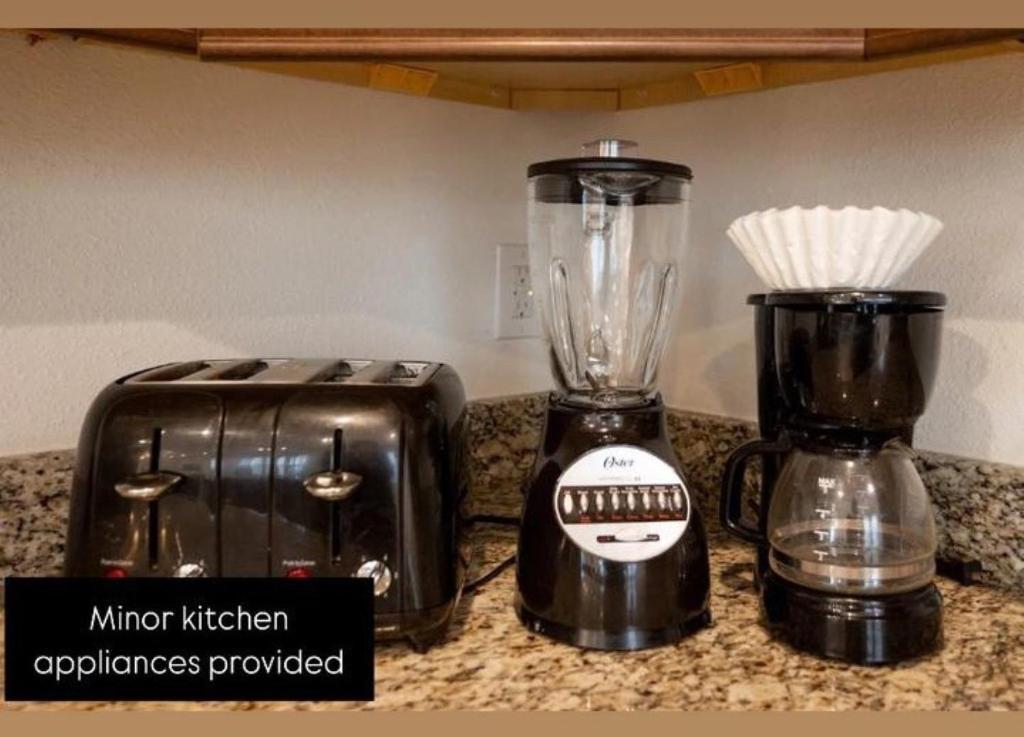 a blender and a toaster sitting on a counter at 491-8-LD-Private Pool with Game and Movie in Orlando