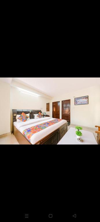 a bedroom with a large bed in a room at rudra cottage in Shimla