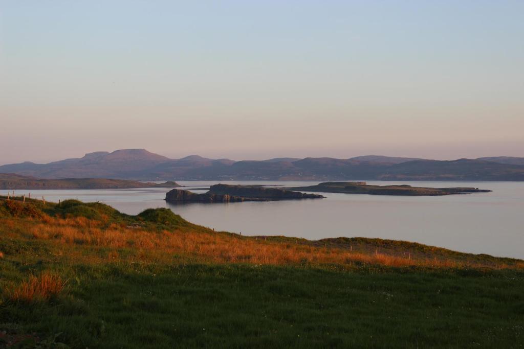 a large body of water with mountains in the background at Bitacora in Hallin