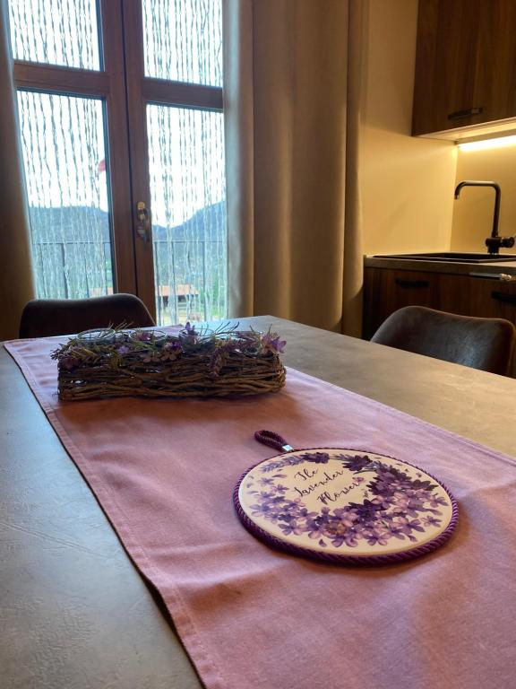 a plate sitting on top of a table with a napkin at Ranch Enbrucà in Boves