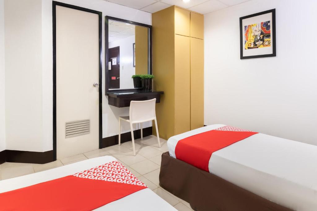Postel nebo postele na pokoji v ubytování Orange Nest Hotel