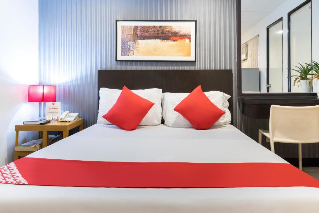 Postel nebo postele na pokoji v ubytování Orange Nest Hotel