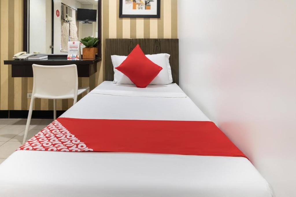 Postel nebo postele na pokoji v ubytování Orange Nest Hotel