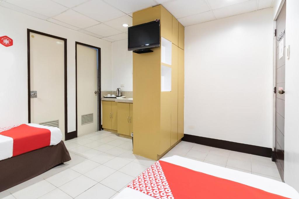 TV a/nebo společenská místnost v ubytování Orange Nest Hotel