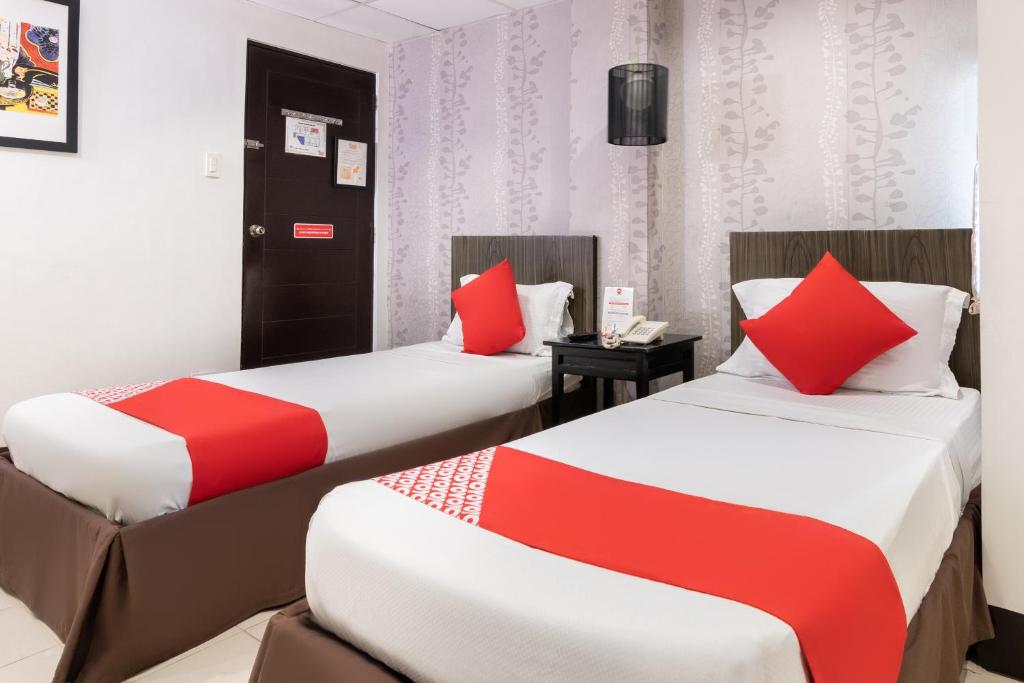 Postel nebo postele na pokoji v ubytování Orange Nest Hotel
