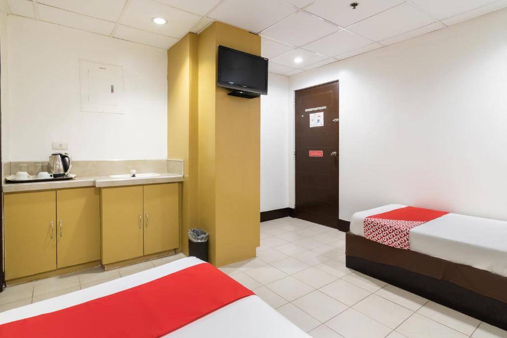 Postel nebo postele na pokoji v ubytování Orange Nest Hotel
