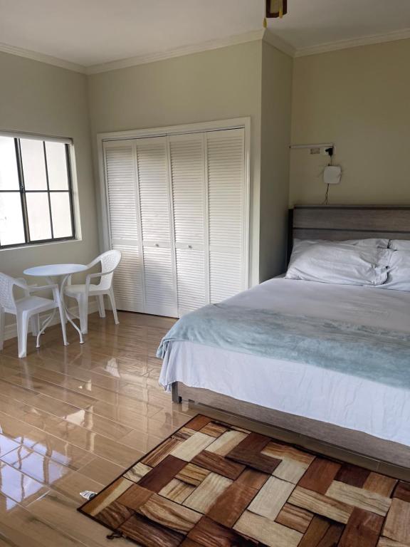 Postel nebo postele na pokoji v ubytování Villa Serenity, Negril Jamaica