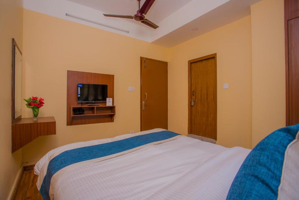 Postel nebo postele na pokoji v ubytování OYO 273 Hotel Rara Palace