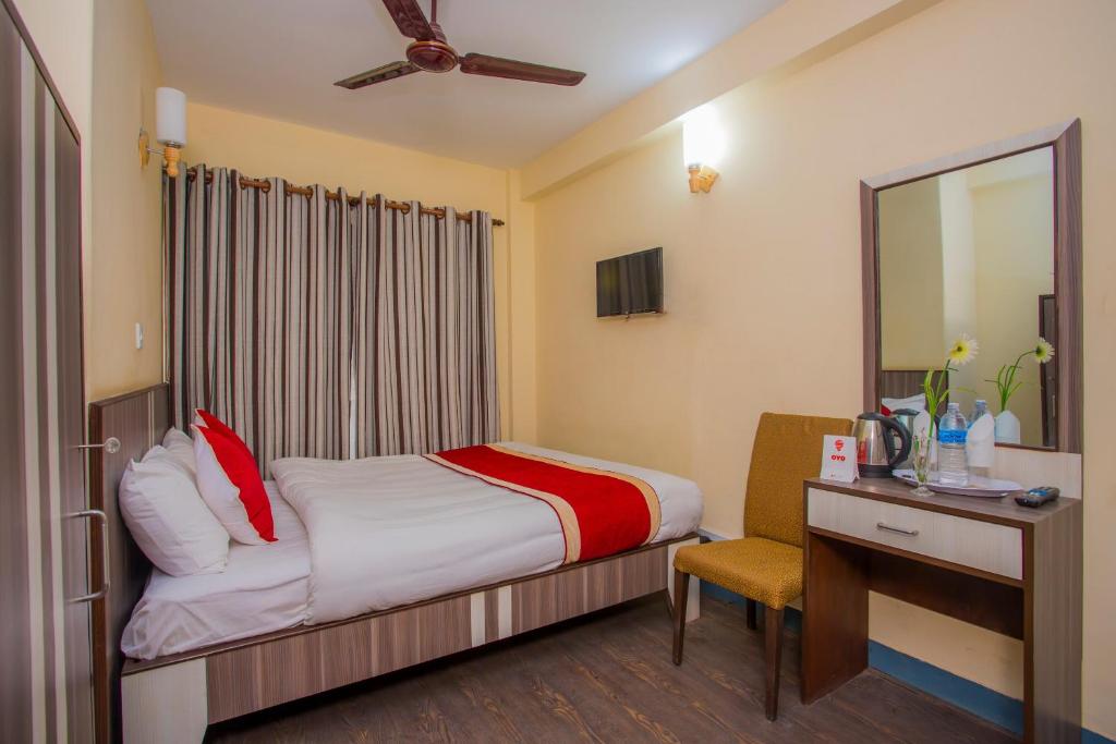 Postel nebo postele na pokoji v ubytování OYO 297 Hotel Aayam