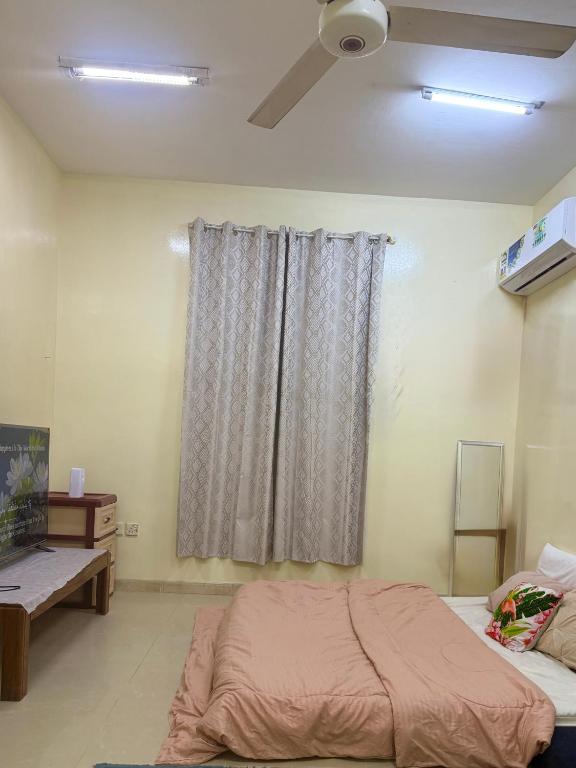 Postel nebo postele na pokoji v ubytování BlessyWail Homestay