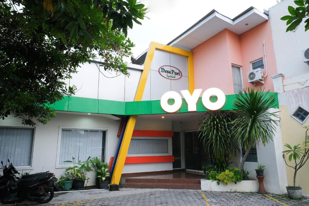 a oo sign on the front of a building at Hotel O Banguntapan Near Galaxy Waterpark Formerly Hotel Desa Puri in Yogyakarta