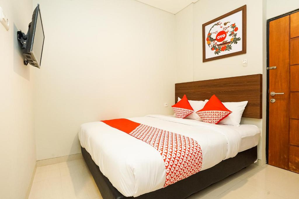 Letto o letti in una camera di Super OYO Capital O 449 The Colins