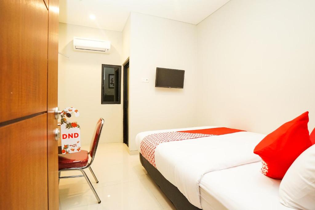 Letto o letti in una camera di Super OYO Capital O 449 The Colins