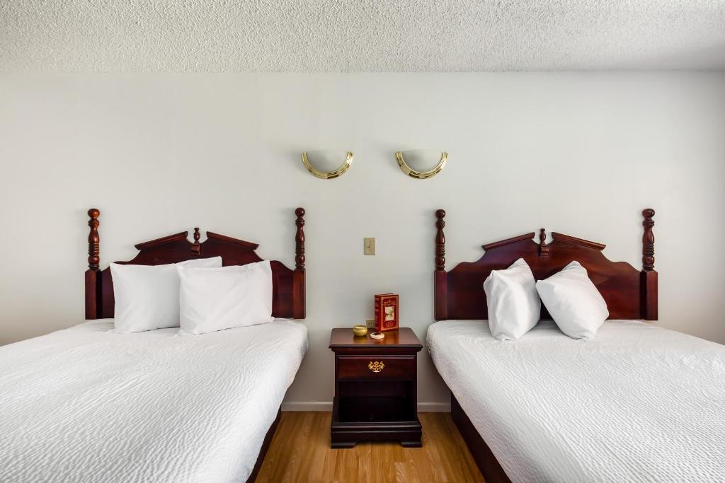 Postel nebo postele na pokoji v ubytování OYO Hotel Groesbeck