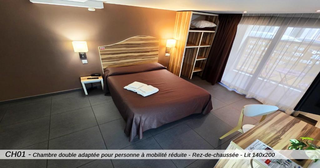 Postel nebo postele na pokoji v ubytování Hôtel Au Valéry