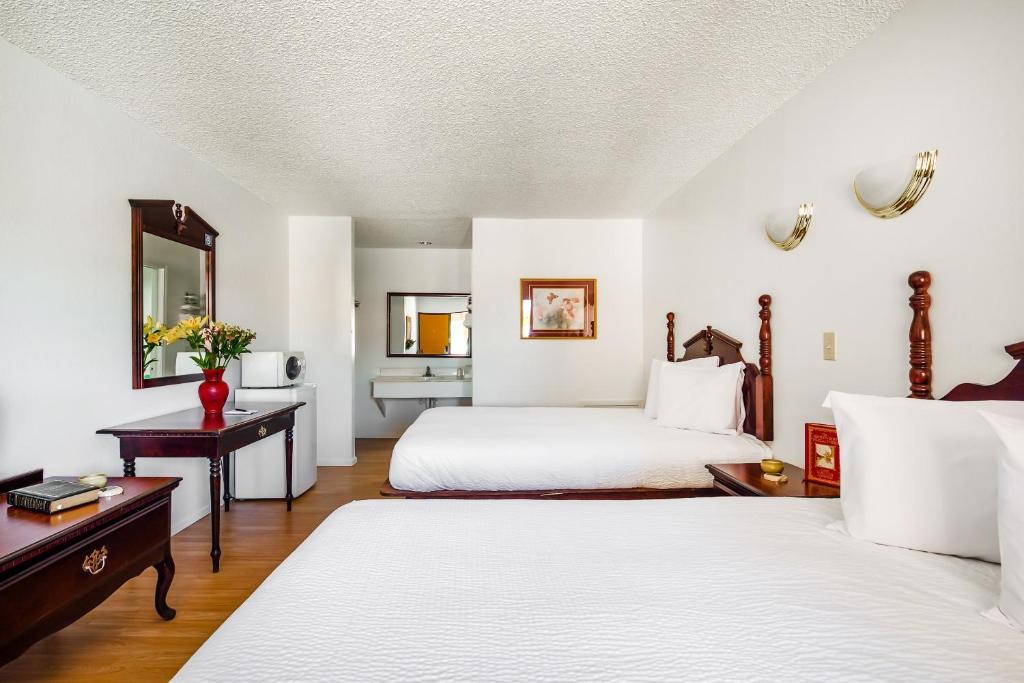 Postel nebo postele na pokoji v ubytování OYO Hotel Groesbeck