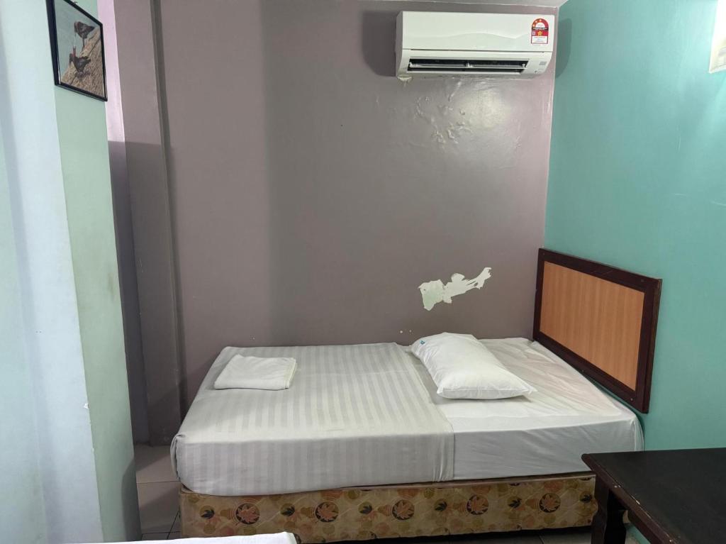 Postel nebo postele na pokoji v ubytování Hotel O Hotel Oriental