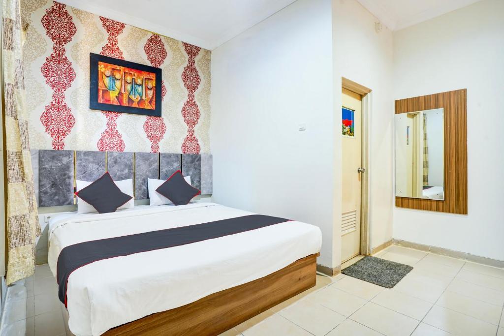 Postel nebo postele na pokoji v ubytování Hotel O Padang City Center Near Pantai Padang Formerly D'Dhave Hotel