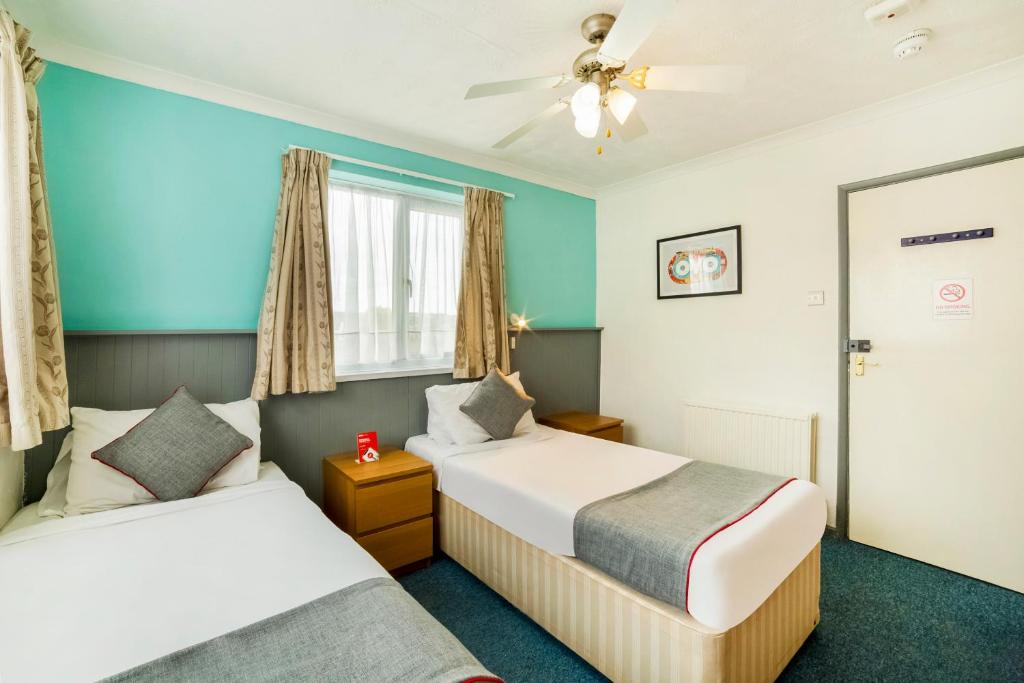 Postel nebo postele na pokoji v ubytování Marina Hotel