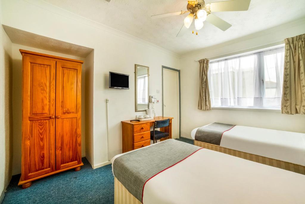 Postel nebo postele na pokoji v ubytování Marina Hotel