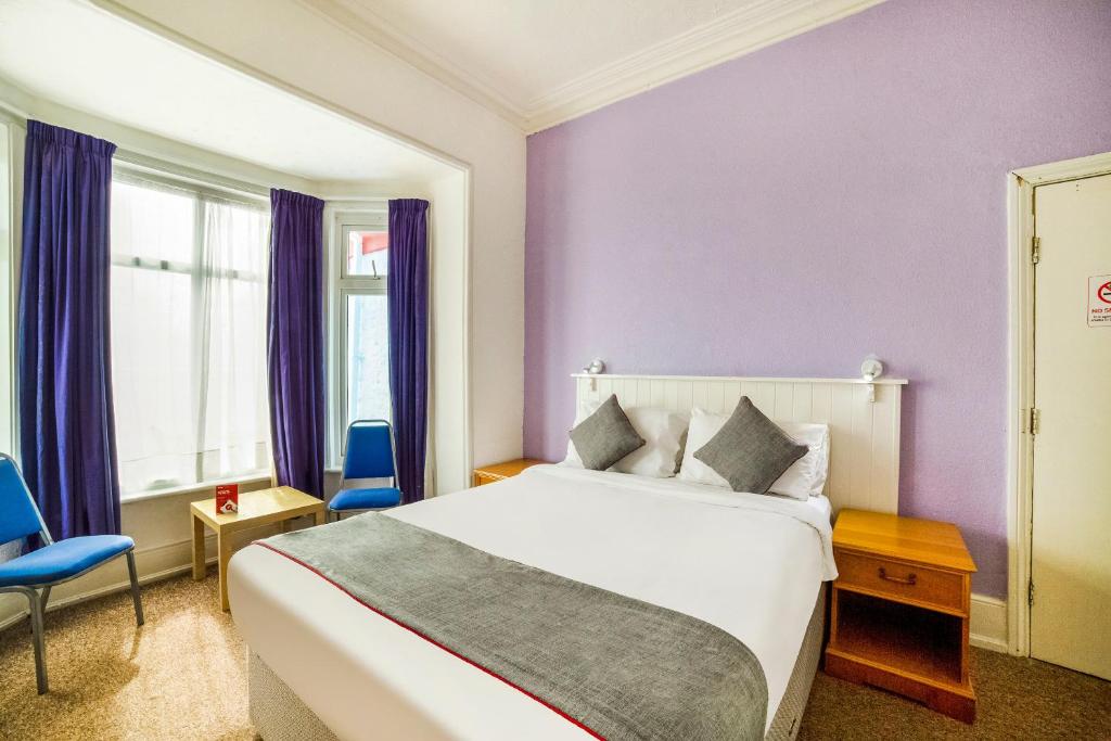 Postel nebo postele na pokoji v ubytování Marina Hotel