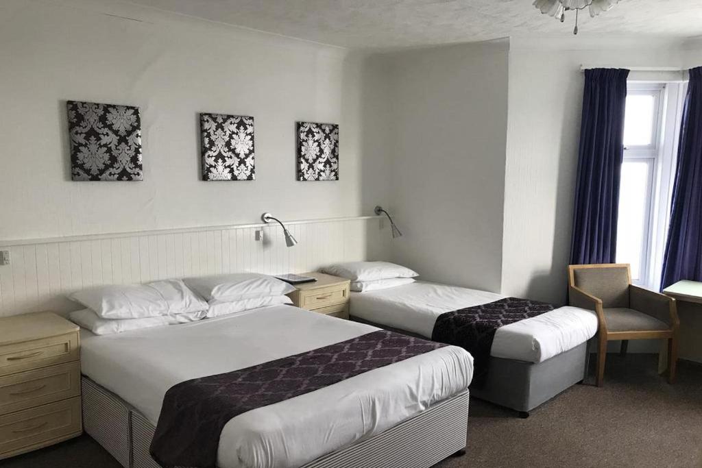 Postel nebo postele na pokoji v ubytování Marina Hotel