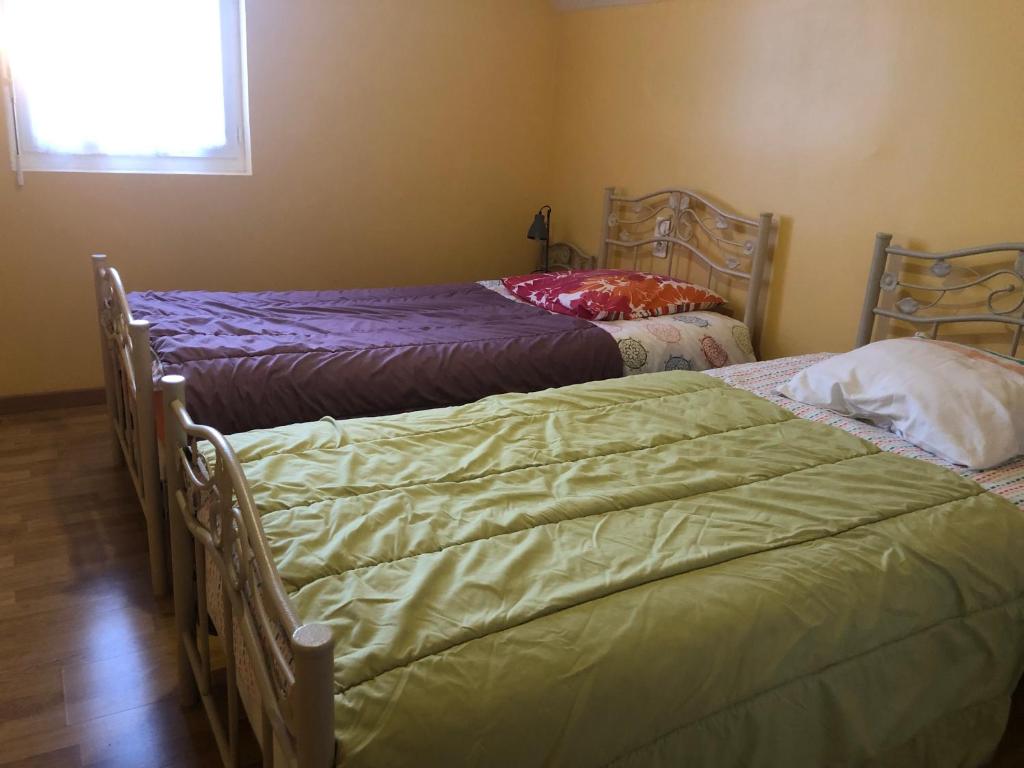 Postel nebo postele na pokoji v ubytování Gîte Argouges