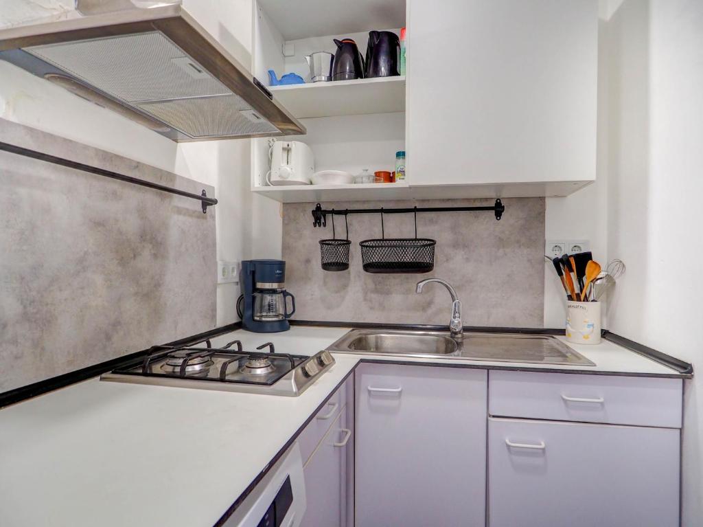 Kuchyň nebo kuchyňský kout v ubytování Gladiator Apartment by Hello Homes Sitges