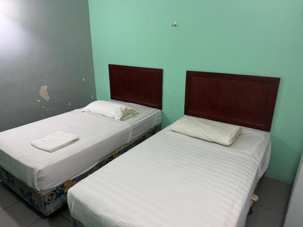 Postel nebo postele na pokoji v ubytování Hotel O Hotel Oriental