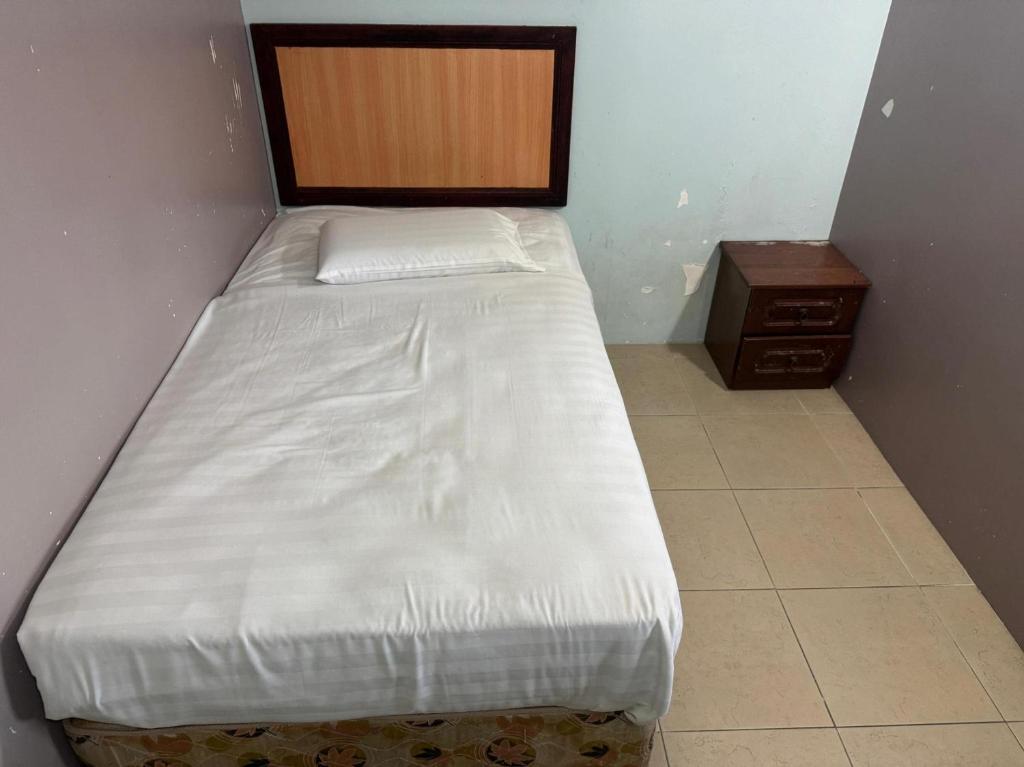 Postel nebo postele na pokoji v ubytování Hotel O Hotel Oriental
