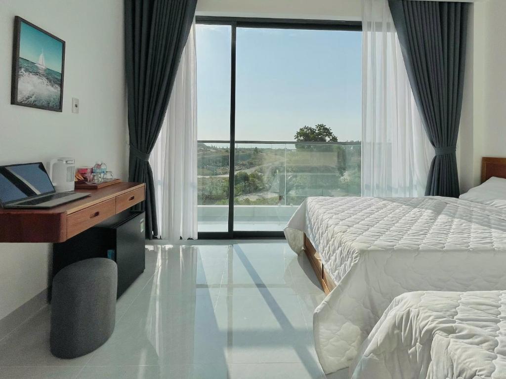 Photo de la galerie de l'établissement Blue Star Viên Hotel, à Binh Tien