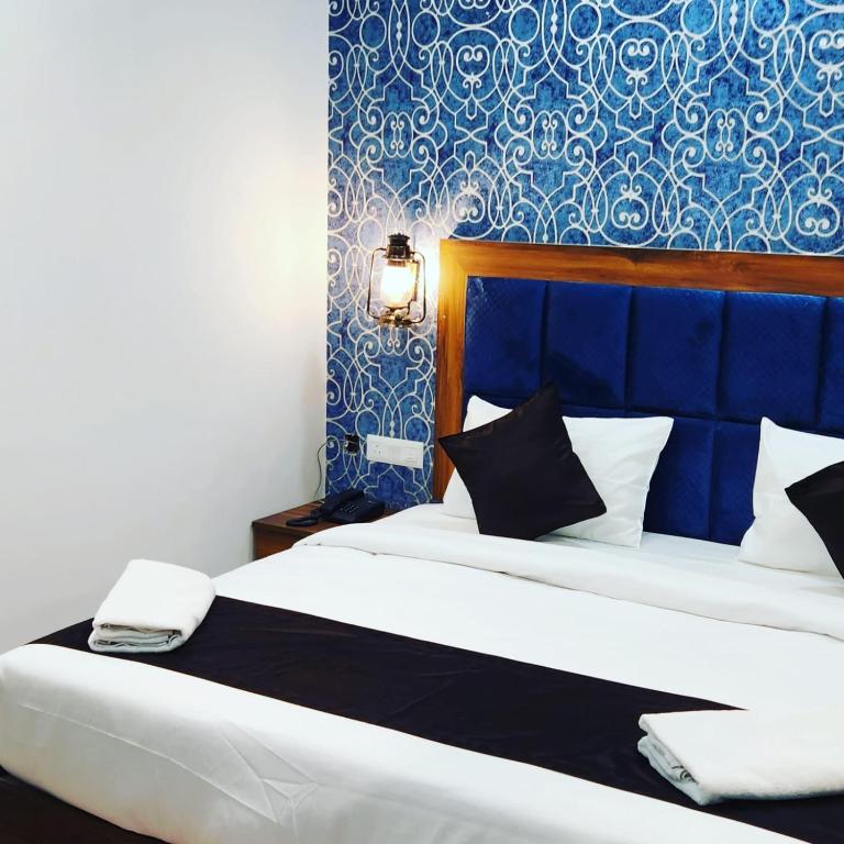 Postel nebo postele na pokoji v ubytování Hotel Agra Hotel Grand View