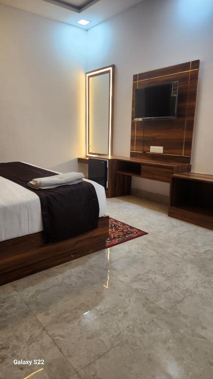 Postel nebo postele na pokoji v ubytování Hotel Agra Hotel Grand View