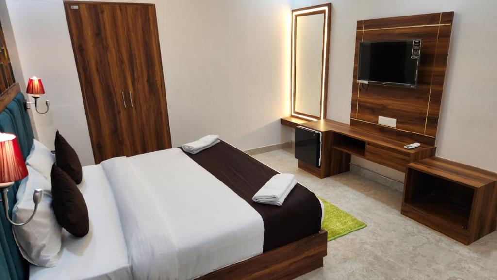 Postel nebo postele na pokoji v ubytování Hotel Agra Hotel Grand View