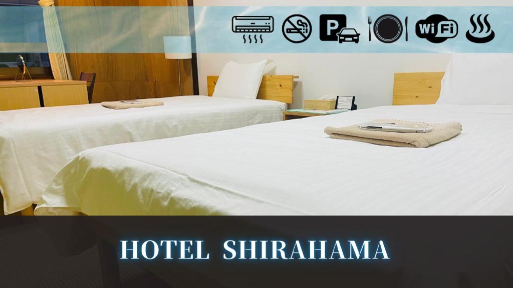 Postel nebo postele na pokoji v ubytování Hotel shirahama