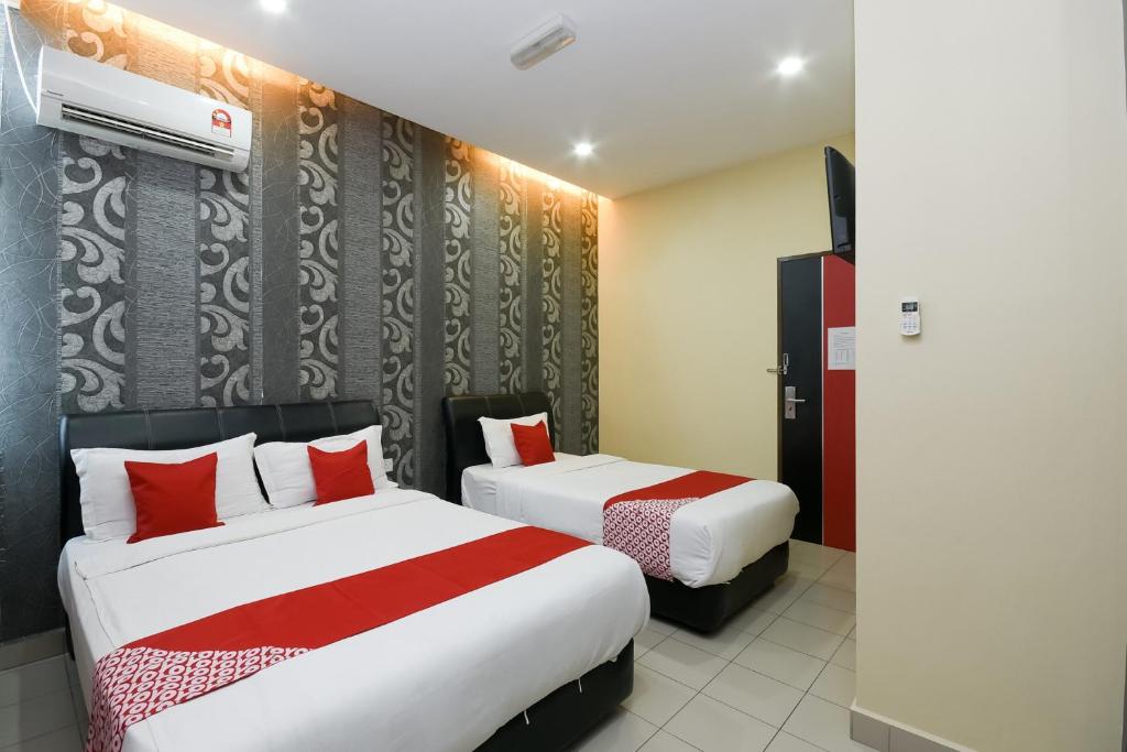 Postel nebo postele na pokoji v ubytování OYO 89301 Ys Inn