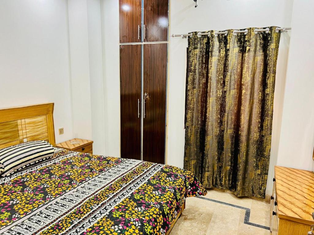 Postel nebo postele na pokoji v ubytování Golden Plaza