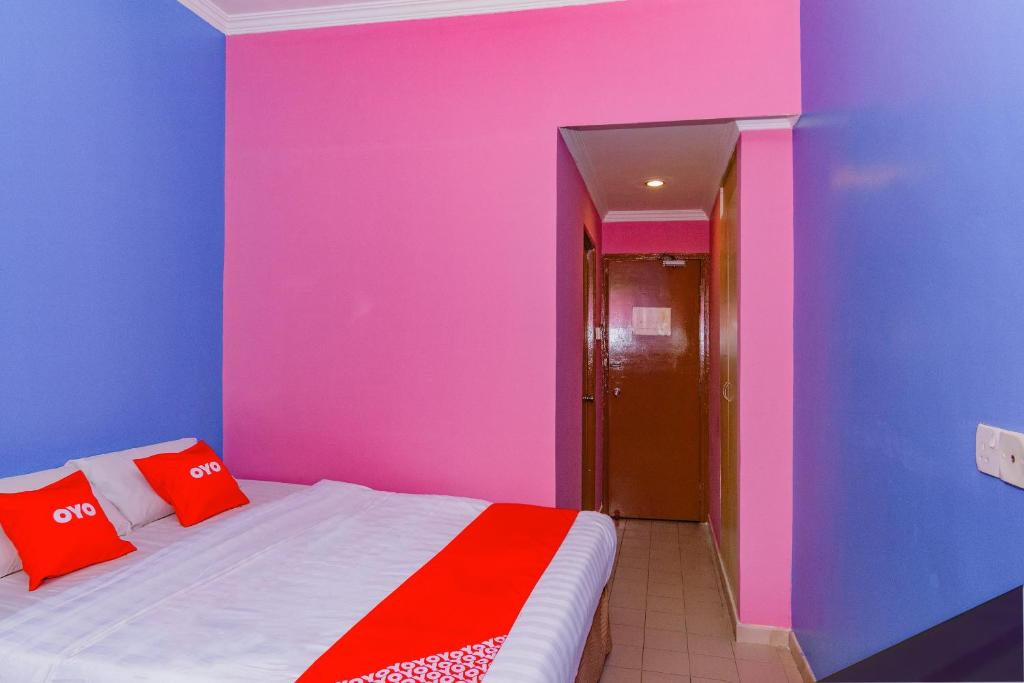 Postel nebo postele na pokoji v ubytování Super OYO 1159 Hotel New Sabah