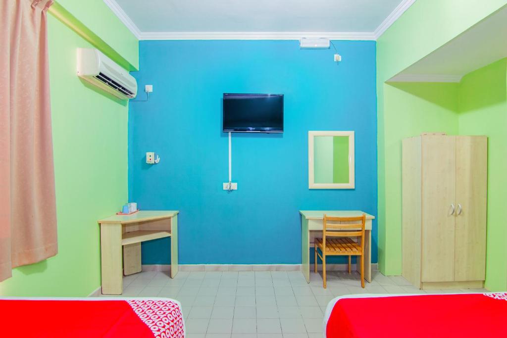TV a/nebo společenská místnost v ubytování Super OYO 1159 Hotel New Sabah