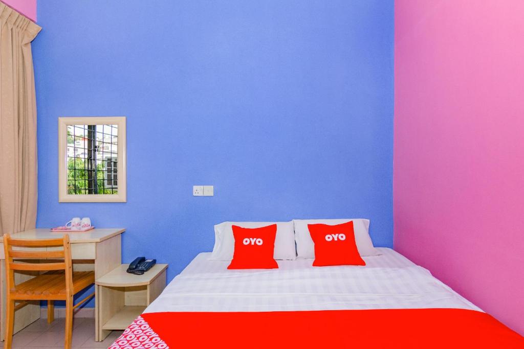 Postel nebo postele na pokoji v ubytování Super OYO 1159 Hotel New Sabah