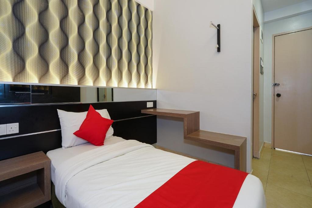 Postel nebo postele na pokoji v ubytování Hotel O Hotel Orchard Inn