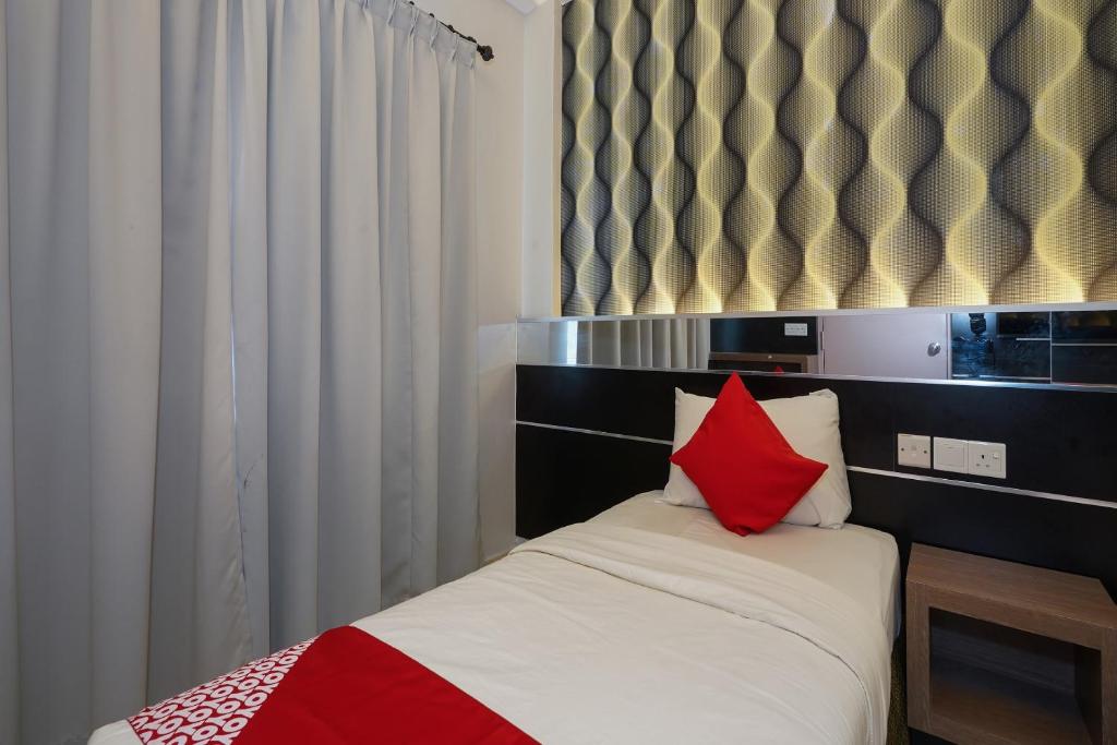 Postel nebo postele na pokoji v ubytování Hotel O Hotel Orchard Inn