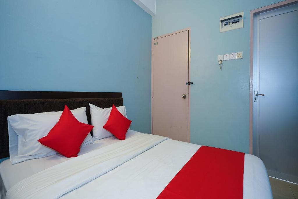 Postel nebo postele na pokoji v ubytování Hotel O Hotel Orchard Inn
