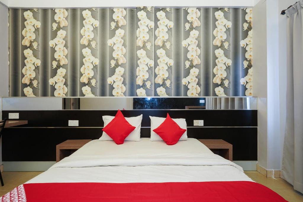 Postel nebo postele na pokoji v ubytování Hotel O Hotel Orchard Inn