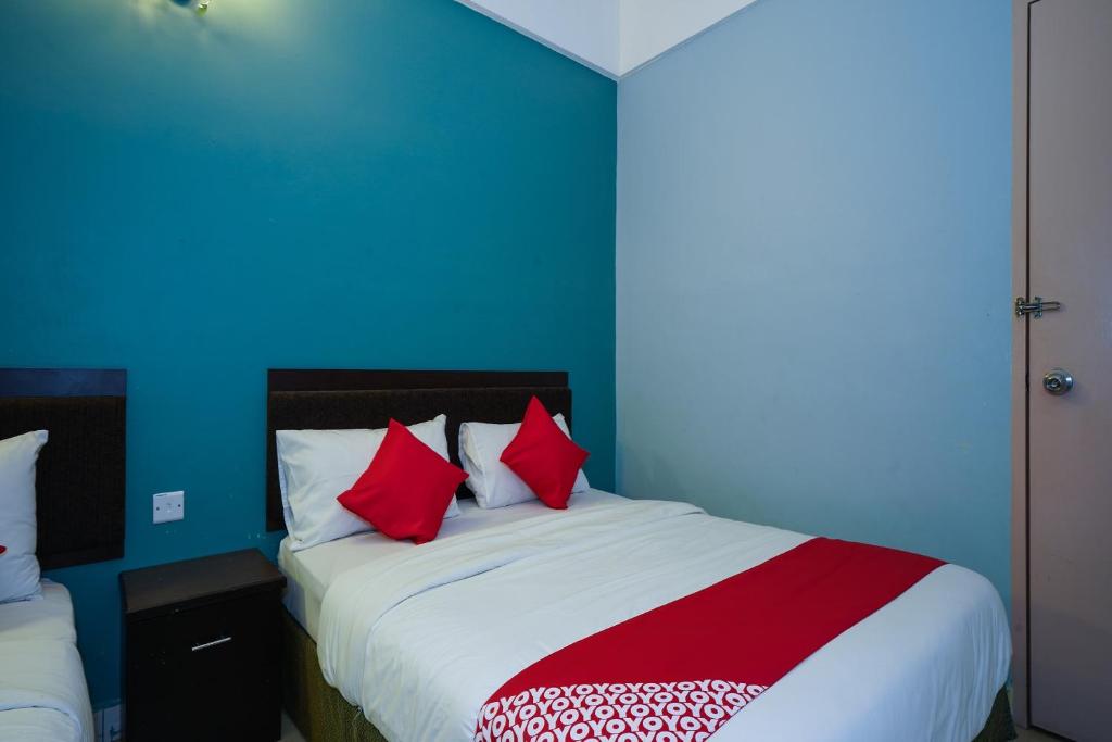 Postel nebo postele na pokoji v ubytování Hotel O Hotel Orchard Inn