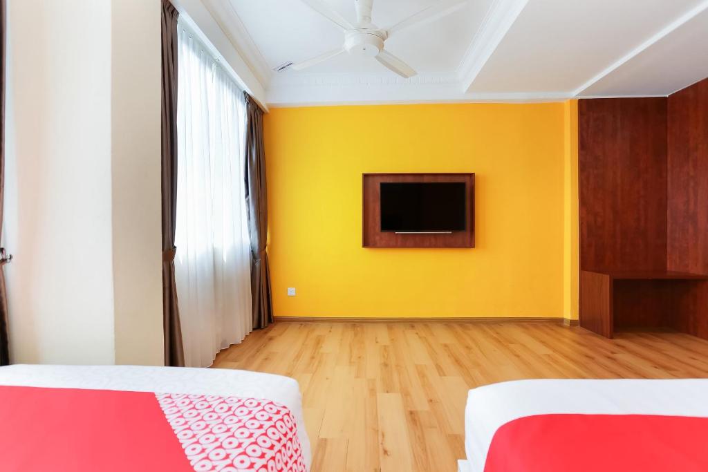 TV a/nebo společenská místnost v ubytování Collection O Hotel Super Cowboy