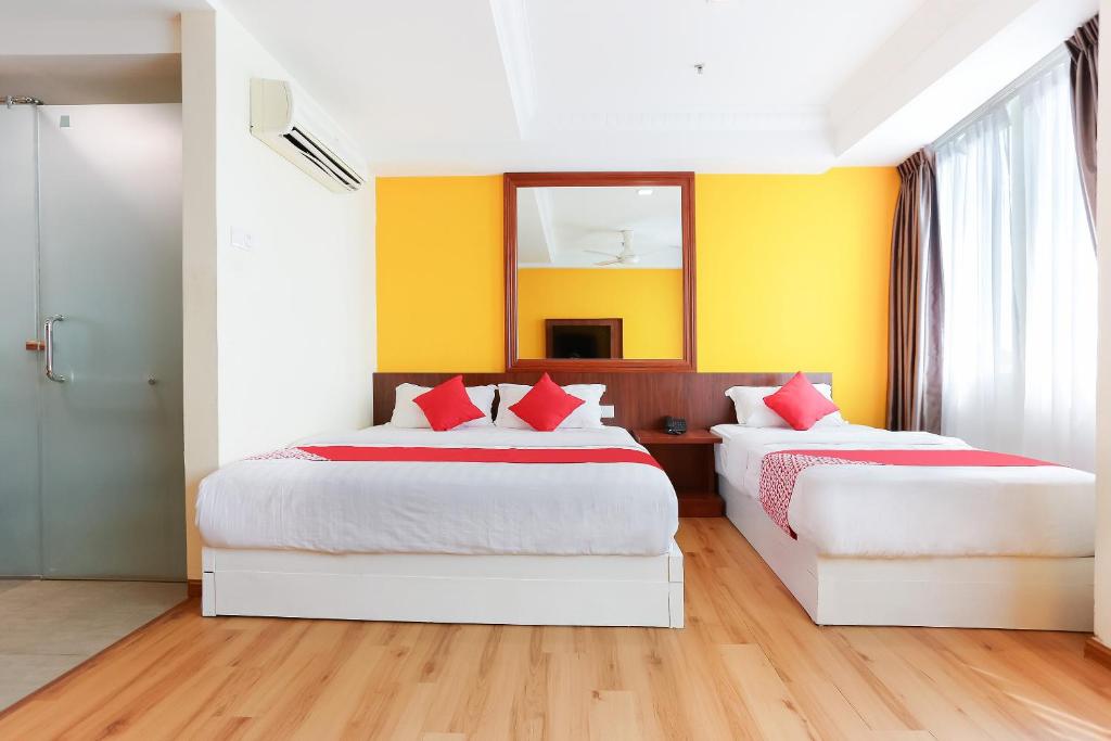 Postel nebo postele na pokoji v ubytování Collection O Hotel Super Cowboy