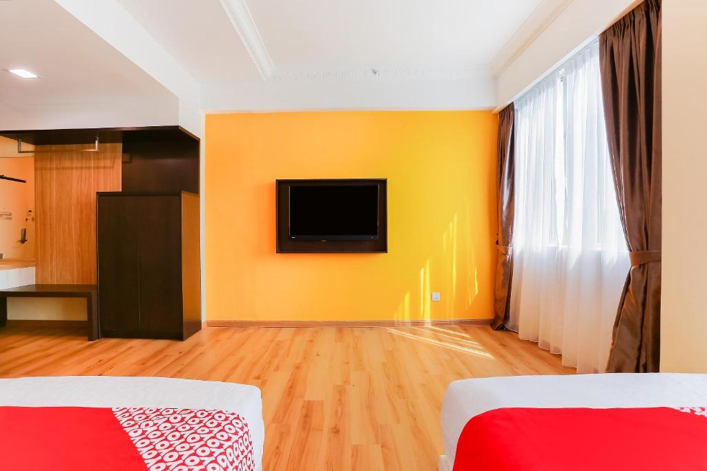 TV a/nebo společenská místnost v ubytování Collection O Hotel Super Cowboy