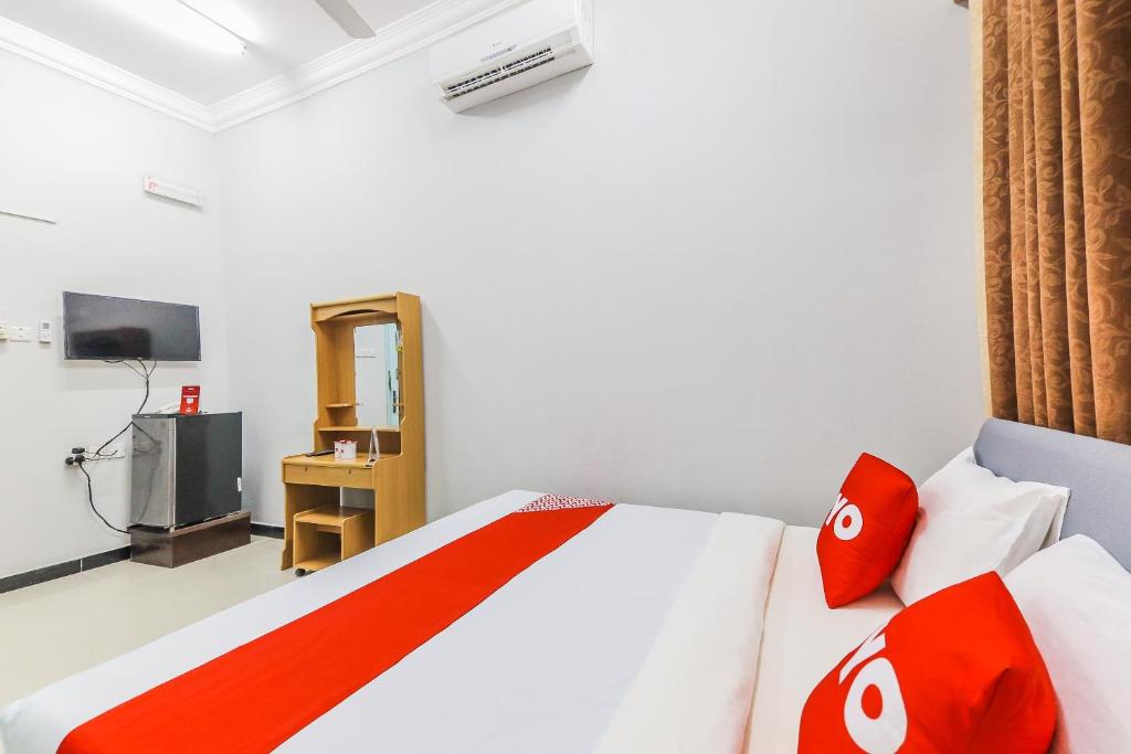 Postel nebo postele na pokoji v ubytování Super OYO 110 Ras Al Hadd Guest House