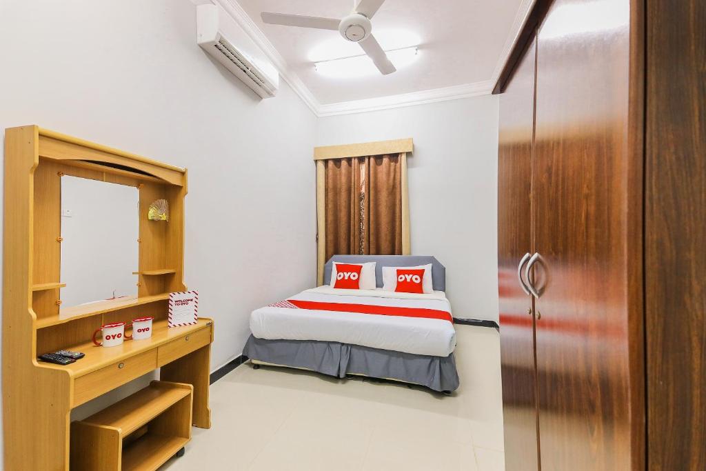 Postel nebo postele na pokoji v ubytování Super OYO 110 Ras Al Hadd Guest House